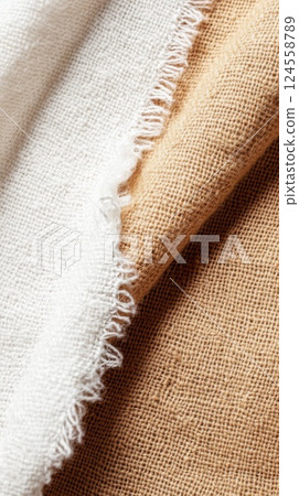 Close up view of a beach towel with contrasting textures of burlap and silk showcasing summer vibes 124558789