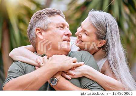 Senior couple, travel and hug in nature for love, support and care outdoor on retirement vacation for health and wellness. Elderly man and women happy about commitment, marriage and quality time 124560065