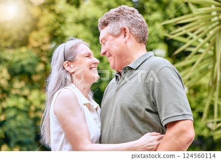 Senior couple hug, retirement and happy, love and care in nature, travel and adventure with holiday and enjoy being retired. Elderly, man and woman smile together, outdoor fun and leisure lifestyle. 124560114
