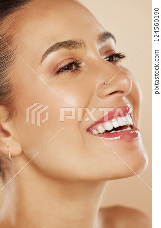 Beauty, makeup and skincare for woman happy after spa facial for natural glow and healthy skin in studio. Female model with smile for dermatology, wellness and health during self care with cosmetics 124560190
