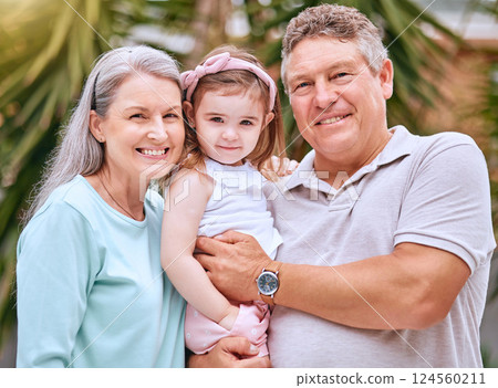 Garden, family and grandparents portrait with young child smile for bond, care and happiness together. Happy, senior and grandmother with grandpa holding girl in Australia for retirement leisure. 124560211