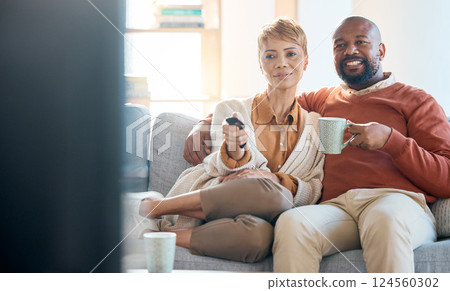 Couple, bonding or television control on sofa for home movie, house show or living room multimedia streaming remote. Happy smile, black woman or mature man watching on tv subscription, coffee or tea 124560302