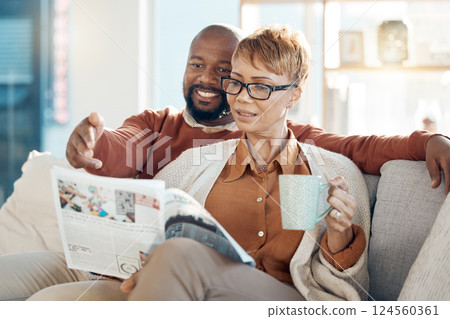 Couple, bonding or reading magazine on sofa in house or home living room for travel ideas, holiday planning or vacation location planning. Happy smile, mature black woman and man with books or coffee Couple, bonding or reading magazine on sofa in house or home living room for travel ideas, holiday planning or vacation location planning. Happy smile, mature black woman and man with books or coffee 124560361
