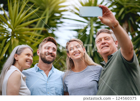 Phone, family and selfie with a man, woman and inlaws posing for a picture together in a garden or yard outdoor. Mobile, happy and smile with a senior father, mother and relatives taking a photograph Phone, family and selfie with a man, woman and inlaws posing for a picture together in a garden or yard outdoor. Mobile, happy and smile with a senior father, mother and relatives taking a photograph 124560375