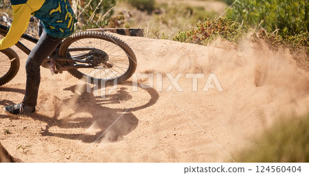 Extreme sport, dirt bike and dust with cyclist riding for adrenaline in competitive competition. Bicycle, fast and biking mountain bike racer ride on dusty path. Sport, athlete and cycling for sports Extreme sport, dirt bike and dust with cyclist riding for adrenaline in competitive competition. Bicycle, fast and biking mountain bike racer ride on dusty path. Sport, athlete and cycling for sports 124560404