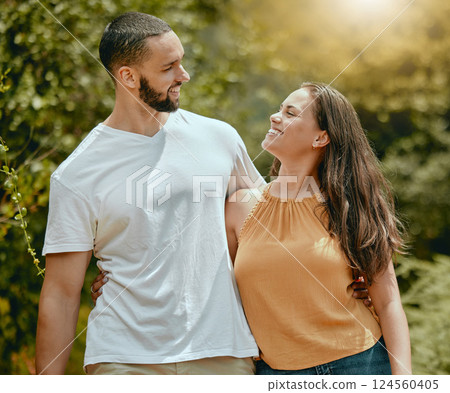 Love, relax and happy with couple in nature walking together for spring, wellness and smile. Romance, peace and summer with man and woman in park for health, hug and marriage lifestyle or date Love, relax and happy with couple in nature walking together for spring, wellness and smile. Romance, peace and summer with man and woman in park for health, hug and marriage lifestyle or date 124560405