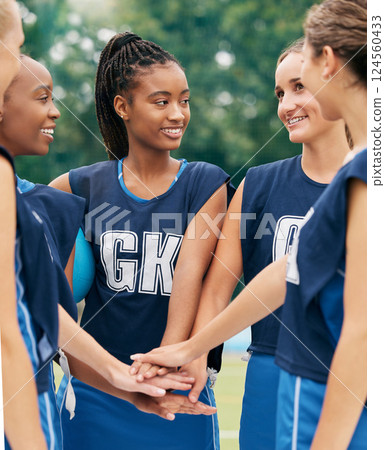 Support, teamwork and sports with netball women for motivation, planning and training on field. Happy, vision and goals with diversity of friends hands in outdoor park for games, summer and workout 124560433