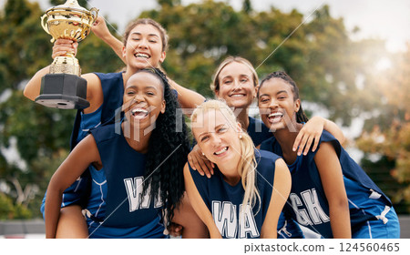 Netball game, team sports and trophy winner in sport competition on court, collaboration for winning and teamwork for success in event. Women athlete celebrate prize and champion achievement together Netball game, team sports and trophy winner in sport competition on court, collaboration for winning and teamwork for success in event. Women athlete celebrate prize and champion achievement together 124560465