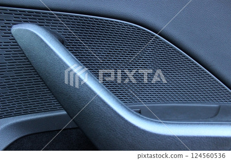 Different textures of plastic panels of the door in the car interior Different textures of plastic panels of the door in the car interior 124560536