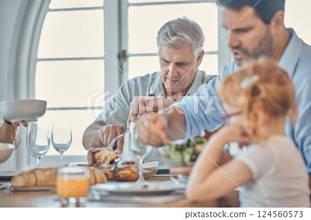 Eating, dining room and senior man with his family enjoying a meal together in their modern house. Father, girl child and grandfather in retirement having food at celebration dinner, lunch or event. Eating, dining room and senior man with his family enjoying a meal together in their modern house. Father, girl child and grandfather in retirement having food at celebration dinner, lunch or event. 124560573