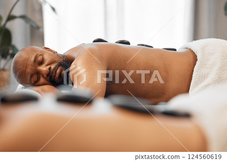 Relax, hot stone massage and mature couple together in luxury hotel spa or salon for romantic anniversary weekend. Health, wellness and romance, relaxing sleep for mature black man on summer vacation Relax, hot stone massage and mature couple together in luxury hotel spa or salon for romantic anniversary weekend. Health, wellness and romance, relaxing sleep for mature black man on summer vacation 124560619
