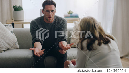 Stress, anxiety and man talking to psychologist on sofa in mental health, anxiety or bipolar counselling therapy. Angry, explaining or crisis patient in psychology counseling communication with woman 124560624