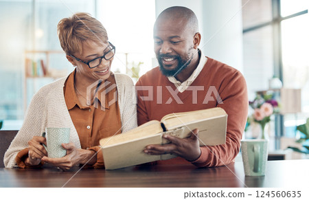 Family, worship and elderly couple with a bible, reading and relax with coffee at table in their home, calm and happy. Prayer, black family and bible study with black woman and man drinking tea 124560635