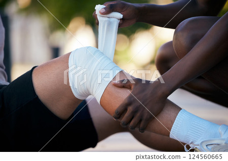 Bandage on legs, injury and pain, sports emergency or accident outdoor with knee sprain, first aid for medical and healthcare. Muscle, joint and wound from exercise, medic and diversity, help injured 124560665