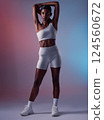 Fitness, stretching and woman in studio for health, wellness and training motivation on soft, aesthetic and background mockup. Exercise, indian and girl model prepare body for workout with mock up 124560672