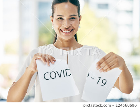 Covid, sign and business woman at the end of the pandemic, happy and smile for freedom from virus at work. Excited, portrait and corporate employee tearing paper for free from corona in an office 124560690