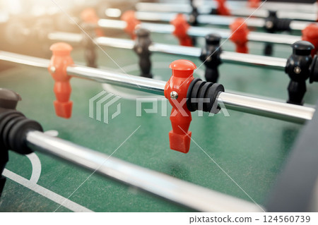 Foosball, game and table for entertainment, fun and team activity with artificial toy or players in zoom. Plastic, arcade and games for competition, competitive and miniature football or soccer field 124560739