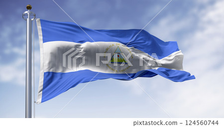 Nicaraguan national flag waving with coat of arms and blue-white tricolor Nicaraguan national flag waving with coat of arms and blue-white tricolor 124560744
