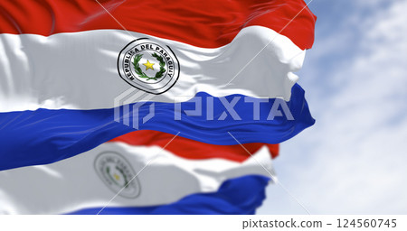 Paraguayan flags waving with national emblem on red white blue tricolor Paraguayan flags waving with national emblem on red white blue tricolor 124560745