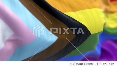 Progress Pride flag close-up with LGBTQIA+ inclusive colors and symbol of unity Progress Pride flag close-up with LGBTQIA+ inclusive colors and symbol of unity 124560746