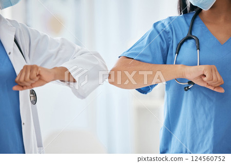 Covid doctor greeting elbow, closeup hospital and ppe work clothes for corona healthcare in workplace. Nurse medic hello, arm touch for social distance or covid 19 medical health safety in clinic 124560752