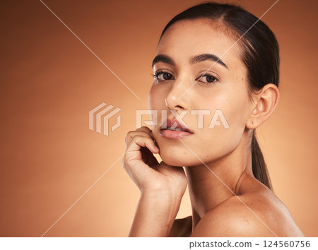 Beauty, makeup and face portrait of woman on brown studio background. Wellness, aesthetic and skincare routine of young female model from Australia with luxury cosmetics, smooth skin or glowing skin Beauty, makeup and face portrait of woman on brown studio background. Wellness, aesthetic and skincare routine of young female model from Australia with luxury cosmetics, smooth skin or glowing skin 124560756