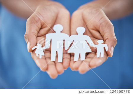 Hands, paper and advertising for family insurance, support and trust with charity, values or community. Woman hand for marketing kindness, family cutout of people with planning life for future 124560778