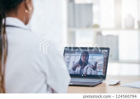Video call, discussion and doctors on an online meeting with laptop in the office of clinic. Healthcare workers talking about medicine, surgery and results in online medical conversation on computer. Video call, discussion and doctors on an online meeting with laptop in the office of clinic. Healthcare workers talking about medicine, surgery and results in online medical conversation on computer. 124560794