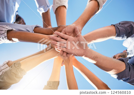 Low angle, hands and circle in success, solidarity or support team building, teamwork collaboration or diversity celebration. Men, women and friends in community huddle for business motivation goals 124560810