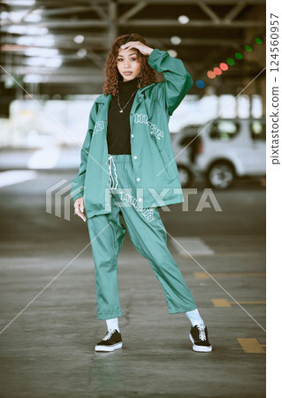 Urban, fashion and girl portrait at parking lot in New York with edgy athleisure style. Gen Z, trendy and statement clothes of young city woman with assertive, confident and cool pose. 124560957