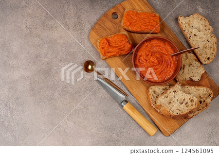 Sandwich of grain bread and squash caviar on a concrete background,healthy breakfast with ingredients,healthy eating concept,space for your text,selective focus 124561095