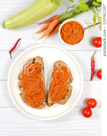 Sandwich with cereal bread and pumpkin caviar on wooden background, healthy breakfast with ingredients, healthy eating concept, space for text, selective focus 124561107