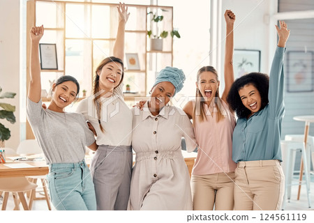 Empowerment, success and portrait of group of women celebrating achievement, win and victory in startup. Teamwork, diversity and businesswomen in celebration with hands in air in creative workspace 124561119