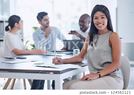 Meeting, corporate and portrait of a business woman planning a project with her team in the office. Happy, smile and professional African employee working on a company strategy in the workplace. 124561121