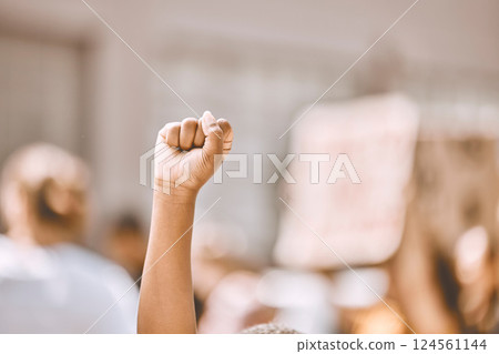 Protest, equality and fist in air in city, crowd of people in street protesting for human rights, freedom and marching. Black lives matter movement, social justice and raised hand of black person Protest, equality and fist in air in city, crowd of people in street protesting for human rights, freedom and marching. Black lives matter movement, social justice and raised hand of black person 124561144