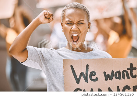 Power, motivation and scream protest of a black woman protesting for social change. Portrait of a young woman activist from New York fighting for women equal rights and justice for black lives matter Power, motivation and scream protest of a black woman protesting for social change. Portrait of a young woman activist from New York fighting for women equal rights and justice for black lives matter 124561150