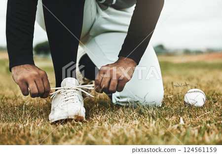 Baseball, shoes and grass with ball and baseball player, sports and fitness closeup during game on baseball field. Competitive sport outdoor, exercise and workout, professional athlete and active. Baseball, shoes and grass with ball and baseball player, sports and fitness closeup during game on baseball field. Competitive sport outdoor, exercise and workout, professional athlete and active. 124561159
