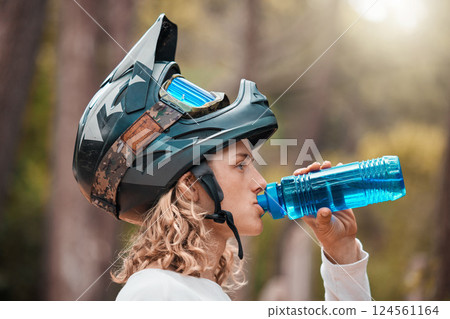 Fitness, cycling and drinking water with man in mountain, training for sports, health and workout. Energy, nature and exercise with athlete and helmet for wellness, summer and bike riding in forest Fitness, cycling and drinking water with man in mountain, training for sports, health and workout. Energy, nature and exercise with athlete and helmet for wellness, summer and bike riding in forest 124561164