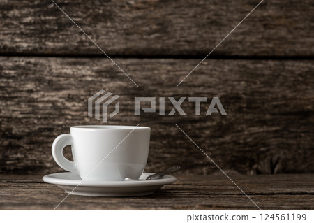White coffee mug over wooden background White coffee mug over wooden background 124561199