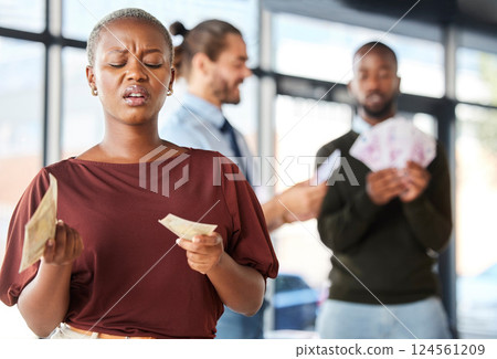 Black woman, unequal pay and confused by wages, paycheck and quote in office, frustrated and annoyed. Angry, woman and reading salary slip with happy colleagues in background, unfair and compensation 124561209