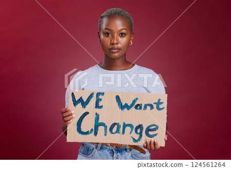 Black woman, protest and billboard message for change, text or voice against mockup studio background. Portrait of African American female activist with banner, poster or sign for empowerment or vote Black woman, protest and billboard message for change, text or voice against mockup studio background. Portrait of African American female activist with banner, poster or sign for empowerment or vote 124561264