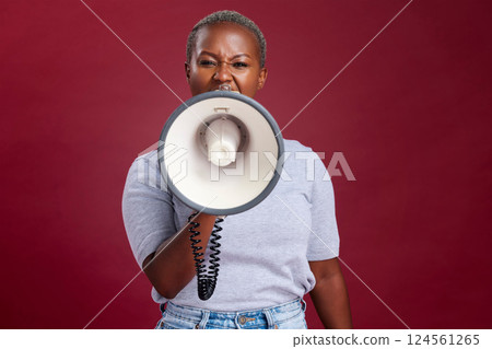 Megaphone, noise and woman in studio for vote, voice and message of change, transformation and democracy on red background. Speaker, black woman and portrait girl speaking protest, strike and opinion Megaphone, noise and woman in studio for vote, voice and message of change, transformation and democracy on red background. Speaker, black woman and portrait girl speaking protest, strike and opinion 124561265