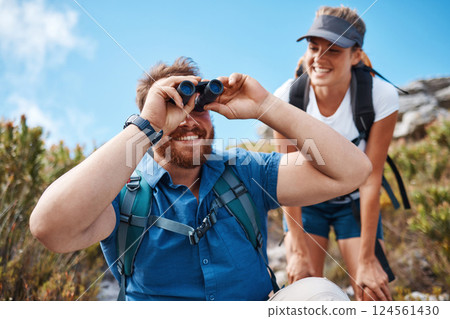 Hiking, nature and couple with binoculars, happy, smile and relax while watching, looking and explore together. Friends, freedom and hikers bond by woman and man laugh, search and enjoy scenic view 124561430