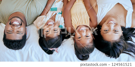 Family, happiness and bedroom playing of mother, father and girl face at home. Portrait of happy parents and children smile in a parent of kid room feeling love, fun and care in a house on a morning 124561521