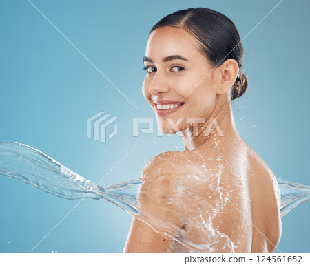 Water, skincare and beauty model splash cleaning skin for body wellness and health from washing. Portrait of a happy and healthy woman from New York with a smile to show happiness and satisfaction Water, skincare and beauty model splash cleaning skin for body wellness and health from washing. Portrait of a happy and healthy woman from New York with a smile to show happiness and satisfaction 124561652