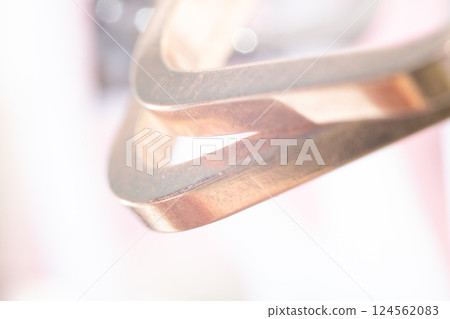 Elegant Close-Up of a Silver Metal Decorative Accessory with Blurred Background Elegant Close-Up of a Silver Metal Decorative Accessory with Blurred Background 124562083