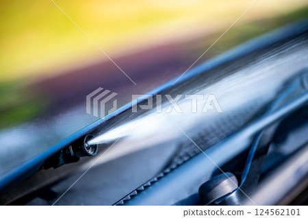 Under hood windshield washer jet used to spray liquid to clean glass on a vehicle. 124562101