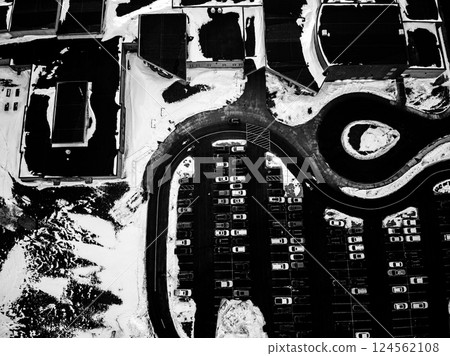 Aerial view of a parking lot in the winter with snow Aerial view of a parking lot in the winter with snow 124562108