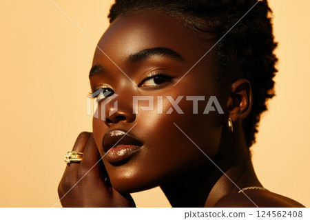 Model with stunning gold ring posed in soft lighting for an elegant showcase of beauty 124562408