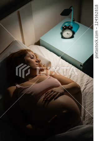 Pregnant woman suffers from insomnia.  124562818